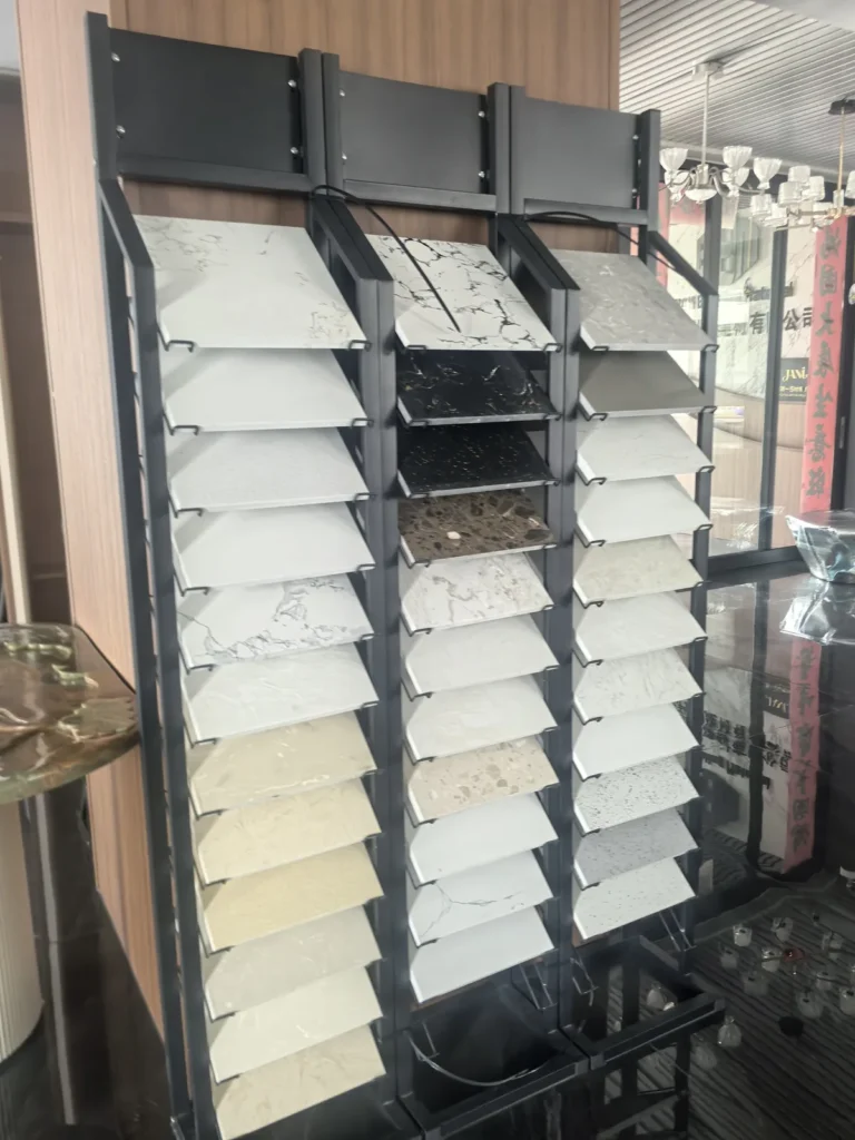 Sample boards in different colours hanging on a display rack in our showroom