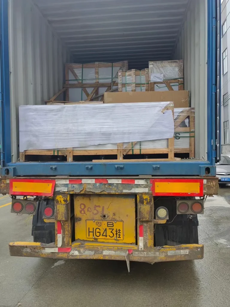 Wrapped slab crate braced inside a shipping container